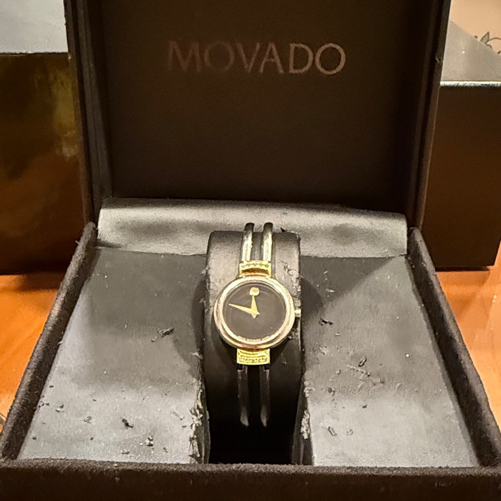 Movado Black and Gold Timepiece